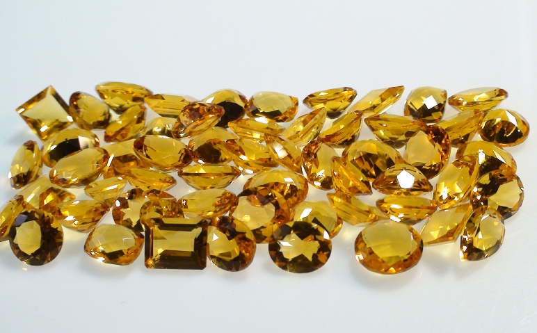 Madeira Citrine Faceted Gemstone Lot of 200 carets on Display