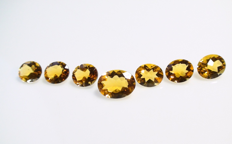 Madeira Citrine Faceted Gemstone Kit of 25 carets on Display