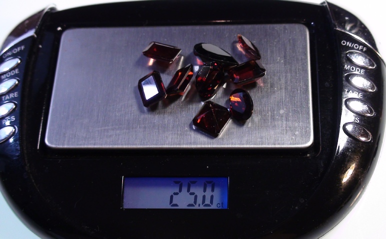 Garnet Faceted Gemstones Parcel of 25 carets on Display