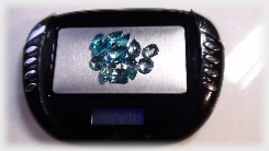 Topaz Faceted Gemstones on scale Parcel of 25 ct