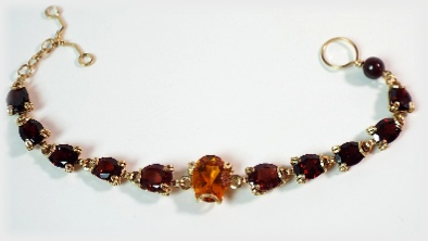 Red Garnets and Orange Sun Madeira Citrine framed in 14 k Gold Filled.